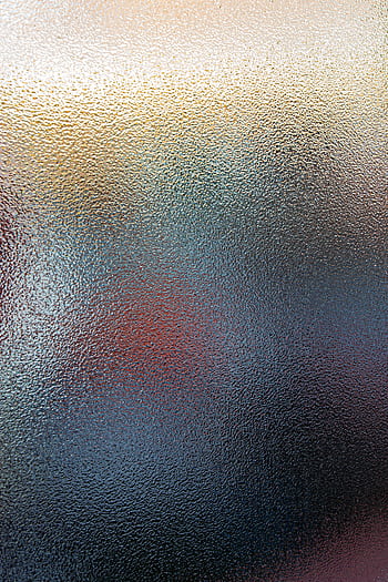 Abstract of a textured glass surface with a vibrant gradient effect, perfect for creative backgrounds. HD phone wallpaper