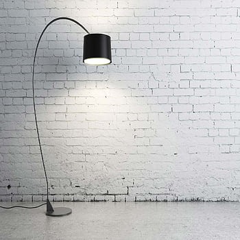 Sleek modern floor lamp casting light on a textured white brick wall. HD phone wallpaper