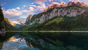 Landscape View Of Rock Mountains Trees Slope Under White Clouds Blue Sky Reflection On Lake Nature HD wallpaper