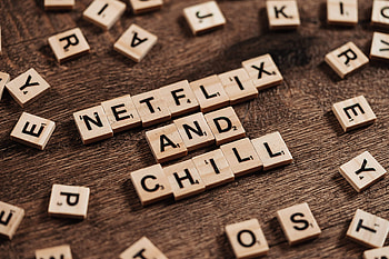 Scrabble and Netflix, Word tile connection, Entertainment reference, Word game symbolism HD wallpaper