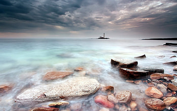 amazing lighthouse on an island off shore, mist, sea, island, shore, lighthouse, rocks HD wallpaper
