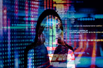 A woman with digital code projections on her face, representing technology and future concepts. HD wallpaper