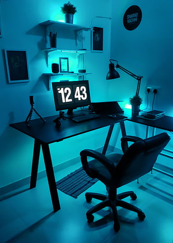Contemporary home office setup featuring blue LED lighting and sleek design elements. HD phone wallpaper