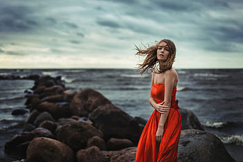 Girl In Orange Dress Wind Blowing At Beach Rocks , girls, orange-dress, model HD wallpaper