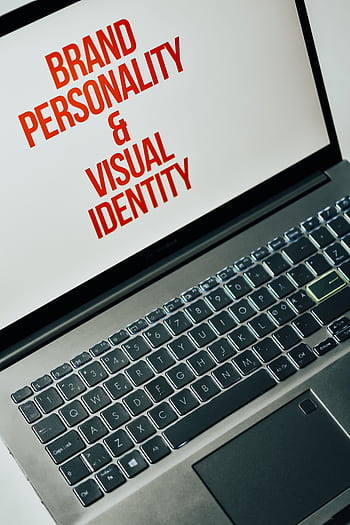 Laptop screen showing text on brand personality and visual identity for marketing strategy. HD phone wallpaper