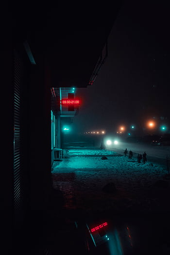 Dramatic night street view with snow and neon signs, perfect for winter urban graphy. HD phone wallpaper