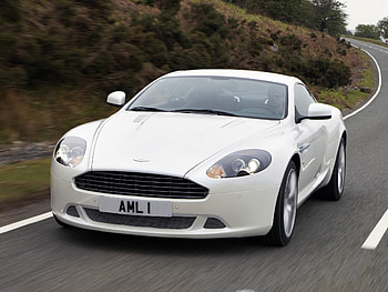 Sports, Auto, Trees, Grass, Aston Martin, Cars, Asphalt, Front View, Speed, Style, Shrubs, Db9, 2010 HD wallpaper