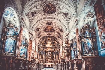 Explore the intricate, ornate baroque architecture inside a historic church, showcasing religious art and spirituality. HD wallpaper