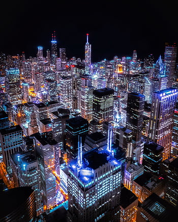 Stunning aerial view of Chicago's illuminated skyline with skyscrapers lit up at night. HD phone wallpaper