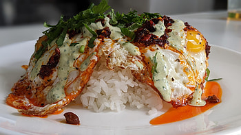 Sunnyside up eggs, Chili crisp topping, Cilantro garnish, Savory breakfast HD wallpaper