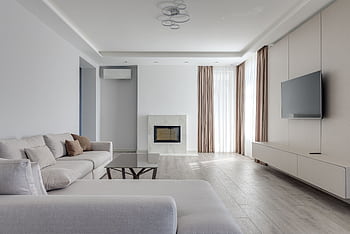 Spacious modern living room interior with cozy couch, fireplace, and large TV. HD wallpaper