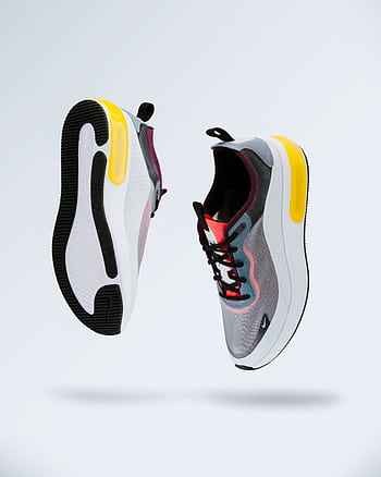 Floating modern sneakers showcasing trendy design and vibrant colors. HD phone wallpaper