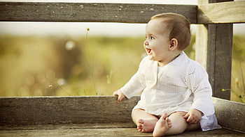 Smiley Happy Face Of Cute Baby Is Sitting On Wood Dock Wearing White Dress In Blur Background Cute HD wallpaper