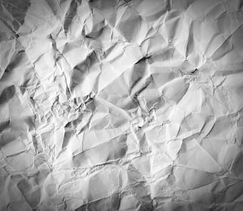 High-resolution crumpled white paper texture ideal for backgrounds, designs, and creative projects. HD wallpaper