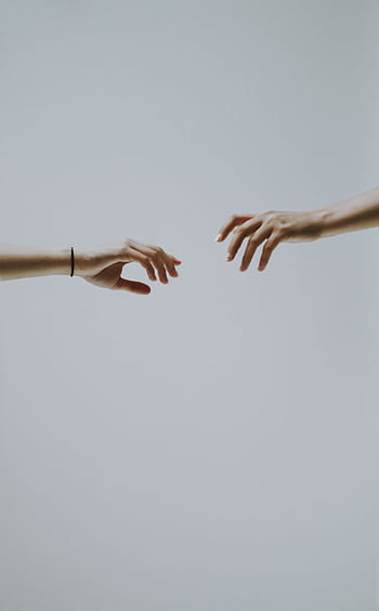 A minimalistic of two hands reaching out to each other against a soft, neutral background. HD phone wallpaper
