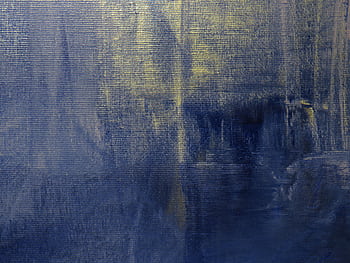 A textured abstract painting in acrylic with dominant blue and yellow hues on canvas. HD wallpaper