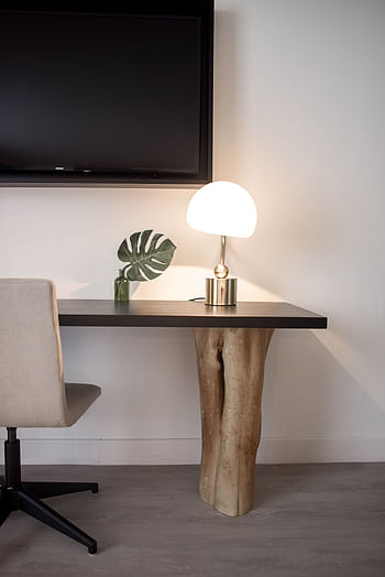Elegantly designed modern workspace featuring a unique wood table, chair, and lamp. HD phone wallpaper