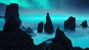 A Person Sitting On Rocks Aurora Bliss , aurora, northern-lights, rocks, nature HD wallpaper
