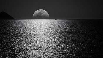 A stunning black and white view of the moonlit ocean in Santorini, Greece. HD wallpaper