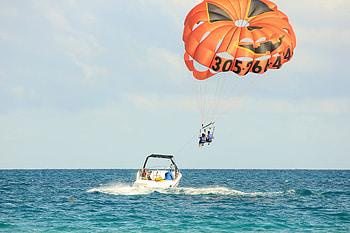 Cloudy skies parasailing, Tandem thrill, Adventure in the air, stock HD wallpaper