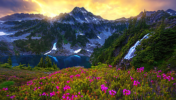 Landscape with mountain and lake, hills, paradise, beautiful, meadow, rocks, sunrise, mountain, lake, wildflowers, waterfall, view, sunset HD wallpaper