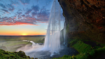 Waterfall Underneath, falls, waterfalls, rock, shore, clouds, nature, sky, water, sunset, ocean HD wallpaper
