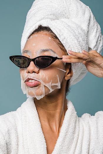 A fashionable woman in a bathrobe and towel with a sheet mask and sunglasses. HD phone wallpaper