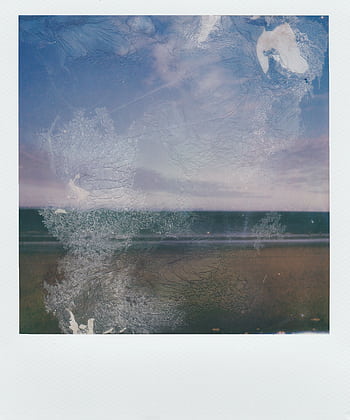 A vintage Polaroid of a seaside landscape with a distressed, artistic effect, evoking nostalgia and tranquility. HD phone wallpaper