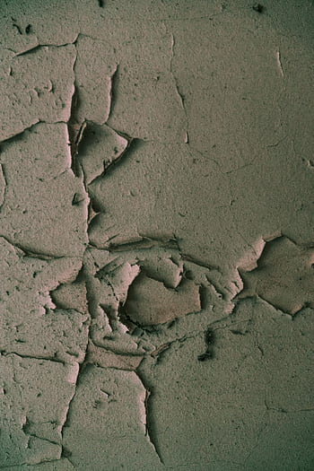 An artistic view of a cracked and textured plaster wall showcasing its aged surface. HD phone wallpaper