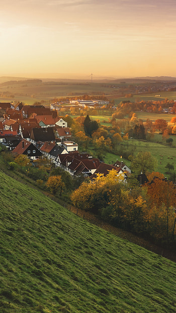 Peaceful town, Fall foliage, Mountain backdrop, Tranquil setting HD phone wallpaper