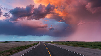 Road Between Grass Field Land Under Black Clouds Blue Sky During Sunset Nature HD wallpaper