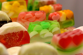 Jelly and fruit medley, Sweet gummy goodness, Colorful candy array, Sugary treats HD wallpaper