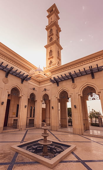 Explore the stunning architectural beauty of a mosque courtyard in Dubai, UAE, perfect for travel and Islamic architecture enthusiasts. HD phone wallpaper