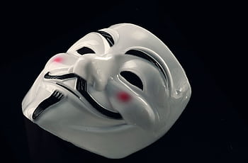 A mysterious Guy Fawkes mask symbolizing anonymity and incognito presence. HD wallpaper