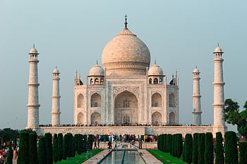 A stunning shot of the Taj Mahal in Agra, showcasing its iconic architecture and serene surroundings. HD wallpaper