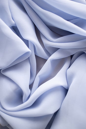Close-up of blue fabric with soft folds, creating a gentle texture and elegant pattern. HD phone wallpaper