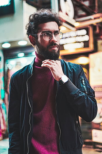 Portrait of a stylish man with glasses in an urban street setting, showcasing modern fashion. HD phone wallpaper