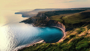 Hidden Turquoise Cove Along Dramatic Cliffs, sea, ocean, mountains, mountain, sky, waves, nature HD wallpaper