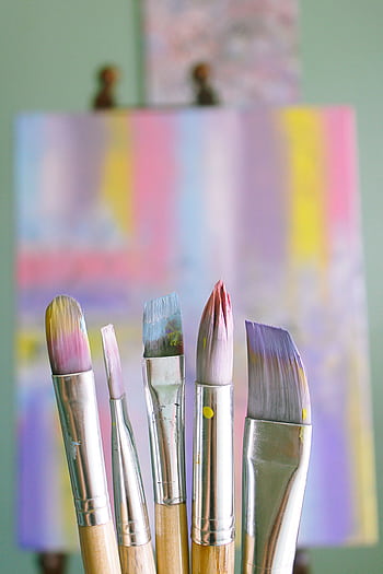Art brushes with abstract painted canvas in vibrant colors. HD phone wallpaper