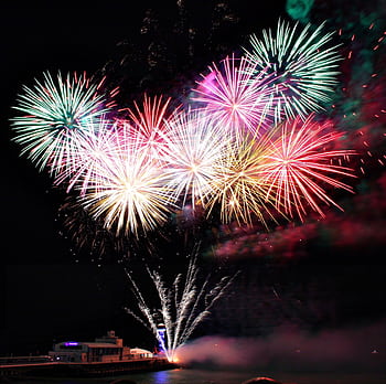 Spectacular fireworks display lighting up the night sky over Bournemouth Pier, England. HD wallpaper