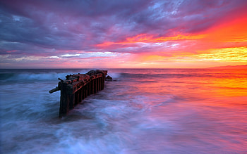 Ocean Waves, colorful, sunlight, colors, peaceful, sunrise, beauty, waves, reflection, seascape, amazing, ocean, sunset, sea, beautiful, rocks, view, clouds, nature, sky, lovely, splendor HD wallpaper