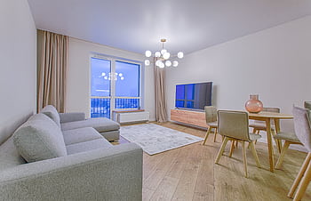A spacious modern living room featuring stylish furnishings and decor. HD wallpaper