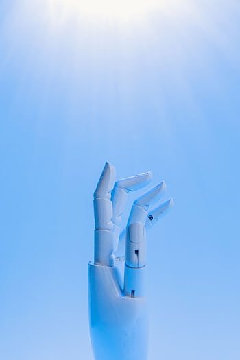 A robotic hand reaching upward against a blue sky, symbolizing technology's future. HD phone wallpaper