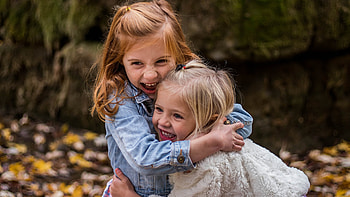Happy Faces Of Two Cute Little Girls Are Hugging Each Other Cute HD wallpaper