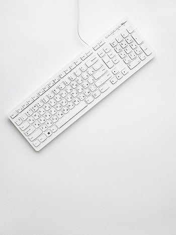 A modern white keyboard on a white background showcasing minimalist design and clean aesthetics. HD phone wallpaper