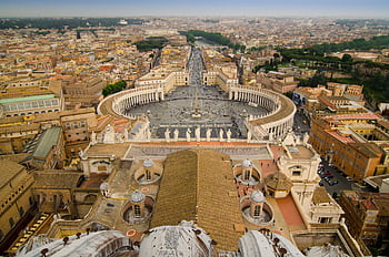 A captivating aerial view of Saint Peter's Basilica and Square in Vatican City, showcasing Roman architecture. HD wallpaper