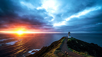 Cape Reinga Lighthouse, North Island, New Zealand, sunset, sea, coast, clouds, colors, sky, rocks HD wallpaper