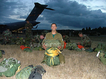 YAHALOM operator (foreground) and U.S. Army Special Forces operators (background) prepare for parachuting during joint training. HD wallpaper