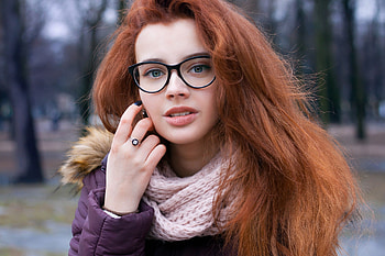 Alisa Bobovnikova, hand on face, model, blue eyes, jacket, long hair, woman, portrait, face, juicy lips, glasses, redhead, women with glasses, scarf, women outdoors HD wallpaper