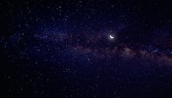 A breathtaking view of the starry night sky featuring the Milky Way and a waning crescent moon. HD wallpaper